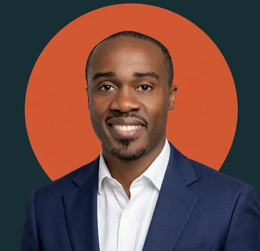 Portrait of Mo Yusuf in a navy blazer