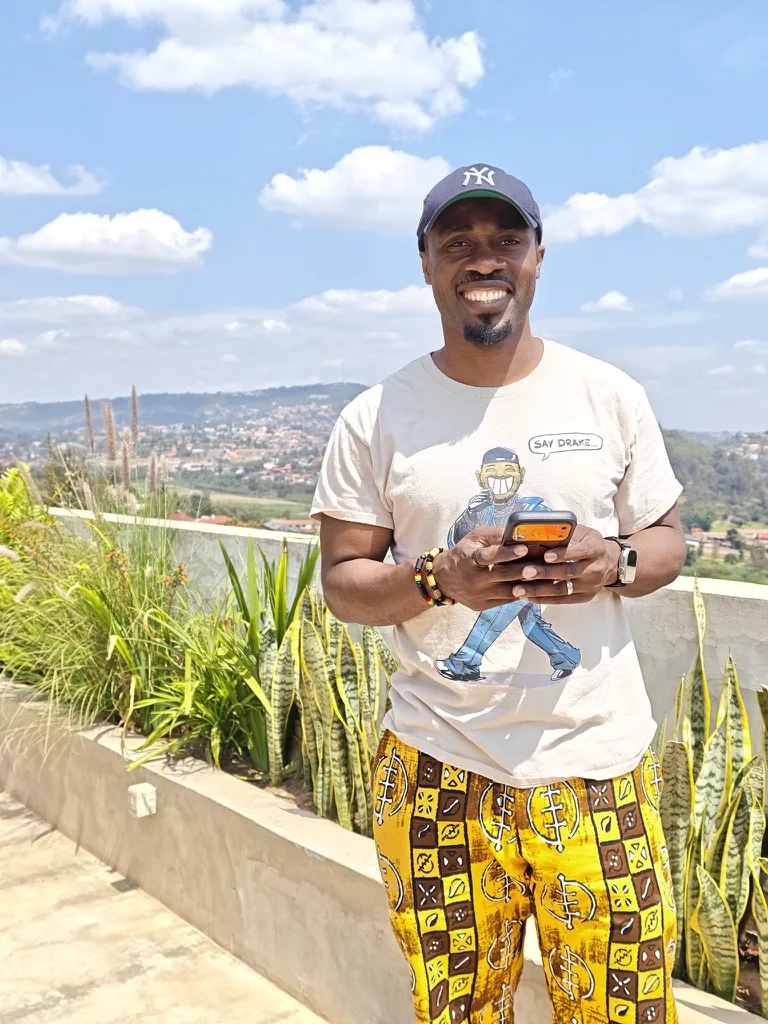 Mo Yusuf on a sunny rooftop overlooking a city